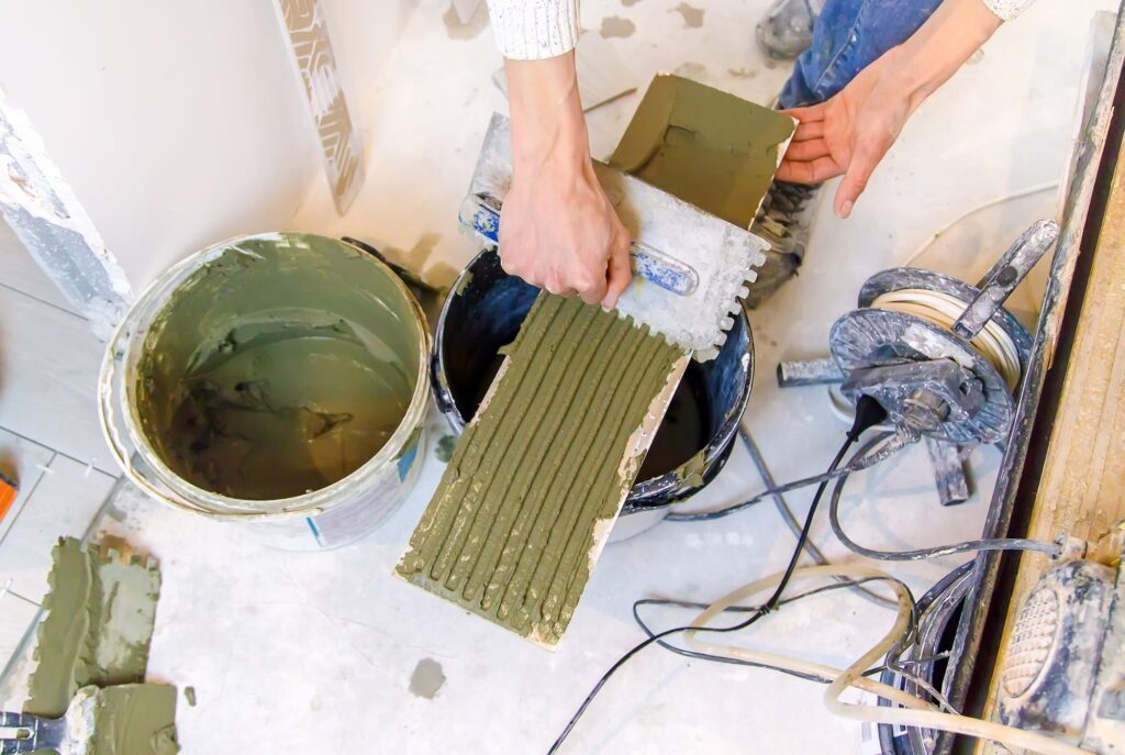 smear the tile repair in the house with a solution. Selective focus.